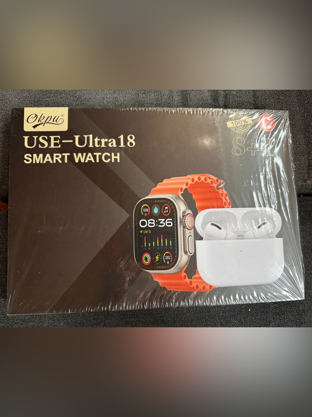 Smart Watch with Orange Band and Wireless Earbuds